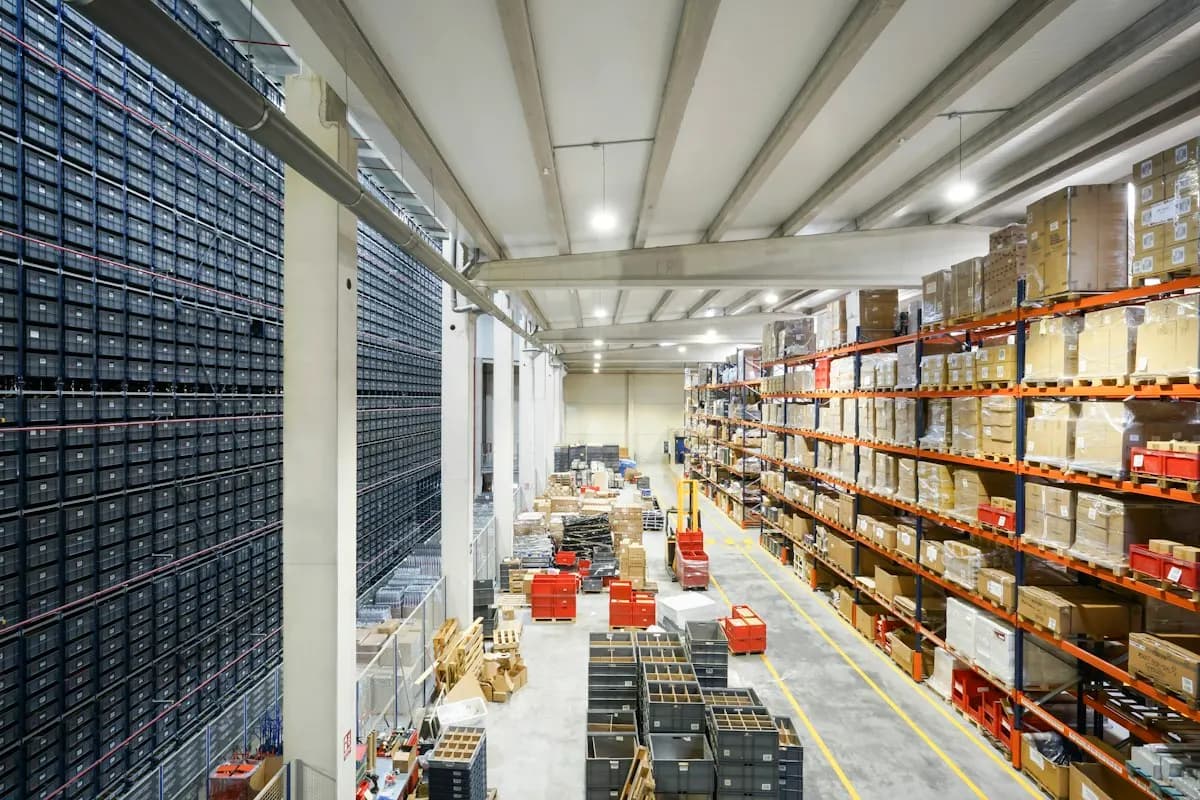 Distribution warehouse with tall shelving and picking aisles