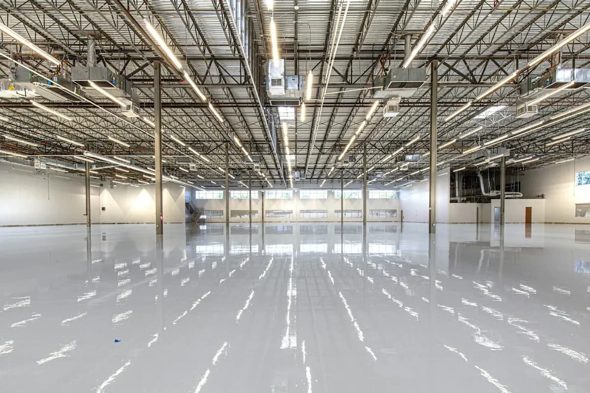 Large empty warehouse with a smooth reflective floor