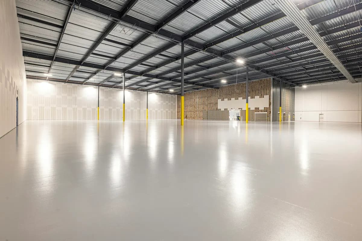 Empty warehouse with a bright reflective floor